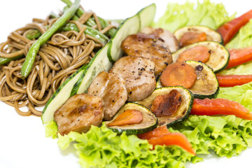 with vegetables and spaghetti on a white background