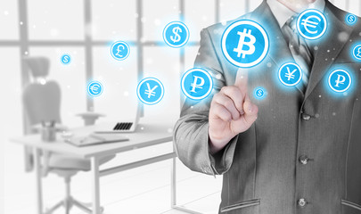 Choosing bitcoins, businessman pressing touch screen button.