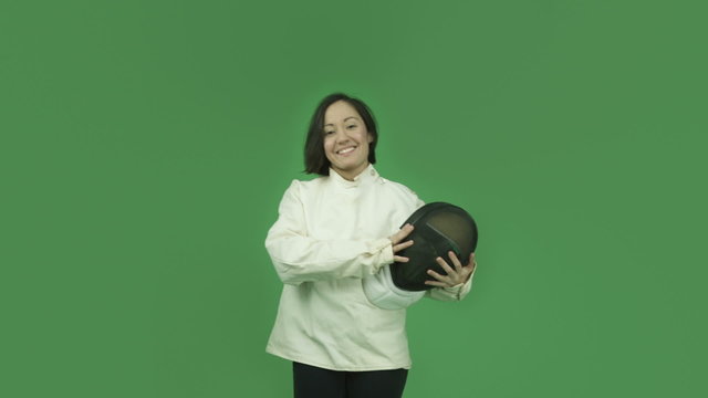 caucasian fencing with sword girl isolated on green screen