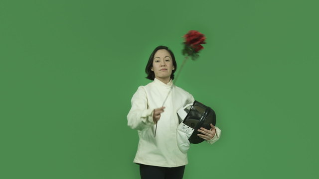 caucasian fencing with sword girl isolated on green screen in