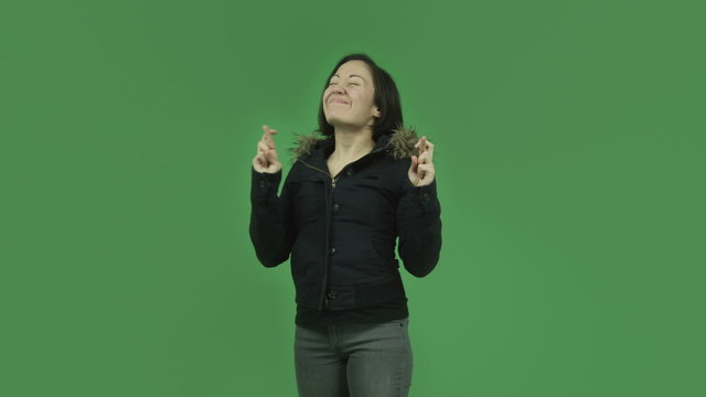 caucasian girl with winter jacket isolated on green screen with