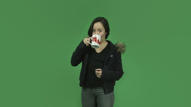 caucasian girl with winter jacket isolated on green screen in