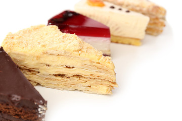 Assortment of pieces of cake, isolated on white © Africa Studio