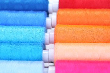 Multicolor sewing threads background