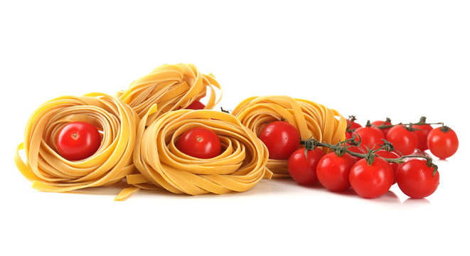 Raw homemade pasta and tomatoes, isolated on white