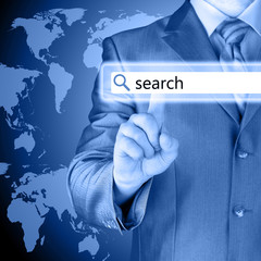 Businessman pushing virtual search bar