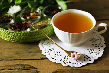 Cup of tasty green tea on table