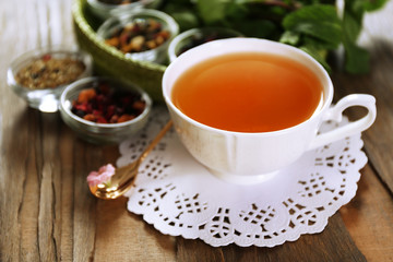 Obraz na płótnie Canvas Cup of tasty green tea on table