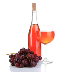 Ripe grapes, wine glass and bottle of wine isolated on white
