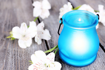 Bright icon-lamp with flowers on wooden background