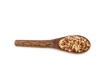 Brown rice on wood spoon