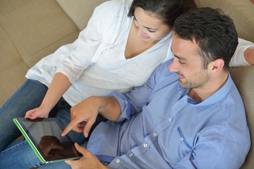 Fototapeta premium couple at home using tablet computer