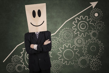 Businessman with carton head and gear