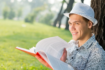 young man reading a book