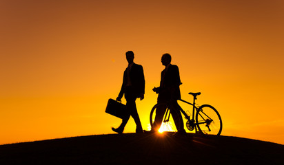 Two Business with Bicycle in Back Lit