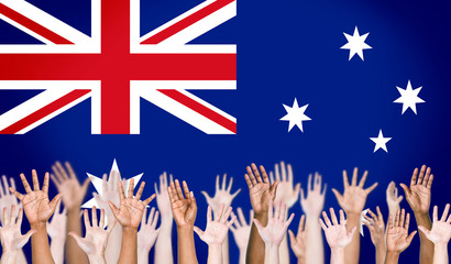 Multi-Ethnic Arms Raised and Austrailian Flag Background