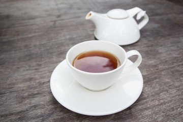 Cup of tea on old wooden table