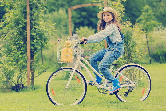 Spring Cycling - filtered image of a girl with bicycle