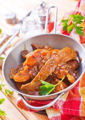 fried meat with tomato sauce