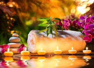 Fototapeten spa massage in garden - candles and water © Romolo Tavani