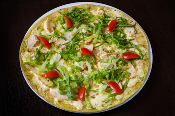 Appetizing pizza with meat of chicken