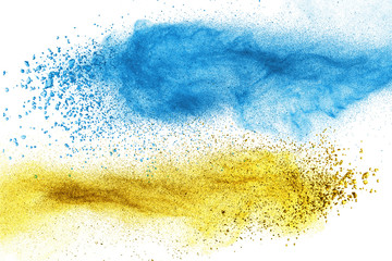 Blue and yellow powder explosion isolated