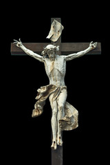 Crucifixion. Christian cross with Jesus Christ statue isolated o - obrazy, fototapety, plakaty