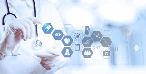 Medicine doctor hand working with modern computer interface as m