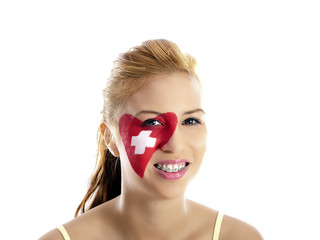 smiling girl with swiss flag painted on her face