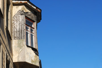 Old balcony on a background of blue sky