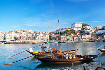 Fototapeta na wymiar traditional boats with wine barrels, old Porto, Portugal