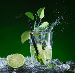 Fresh mojito cocktail in freeze motion splashing