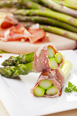 Roasted asparagus with ham and parmesan cheese
