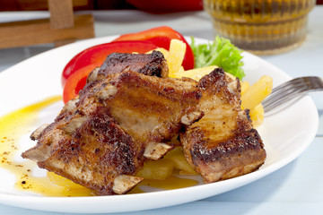 Grilled ribs on plate