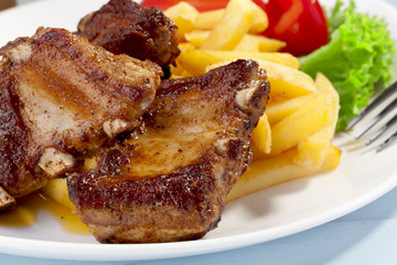 Grilled ribs on plate
