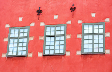 Windows of red iconic buildings on Stortorget, Stockholm