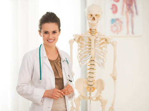 Portrait Of Happy Medical Doctor Woman Teaching Anatomy