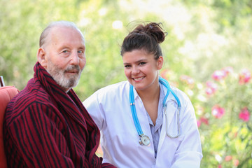smiling senior patient with Doctor or nurse