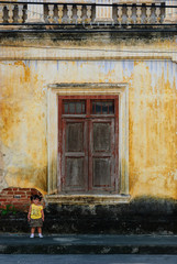 baby girl on vintage window and wall