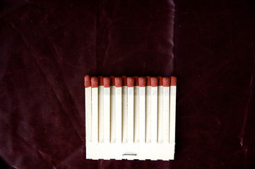 matches row on deep red background