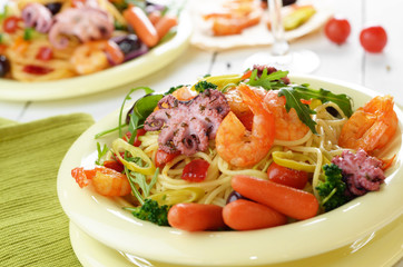 Seafood spaghetti pasta dish with octopus and shrimps