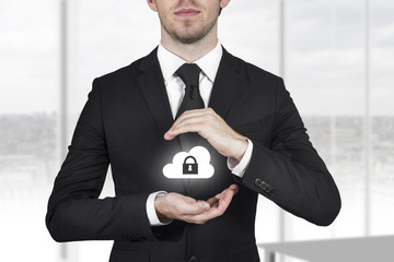 businessman protect cloud lock symbol with hands - obrazy, fototapety, plakaty