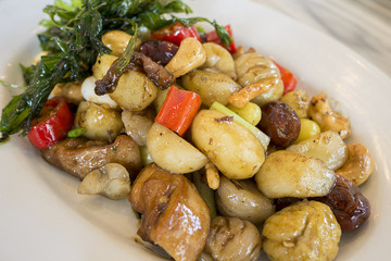 fried chicken with five fruits served on white plate