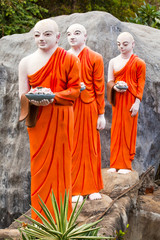 Buddhist monk statues going to Gold Buddha temple, Dambulla, Sri