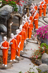 Buddhist monk statues going to Gold Buddha temple, Dambulla, Sri