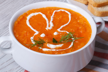 cream soup of carrots for children with bunny close-up