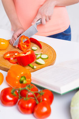 Woman cutting vegetables.