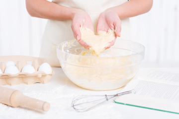 Dough in her hands.