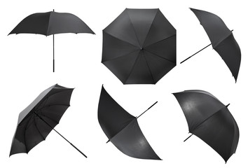 set of open black large umbrellas