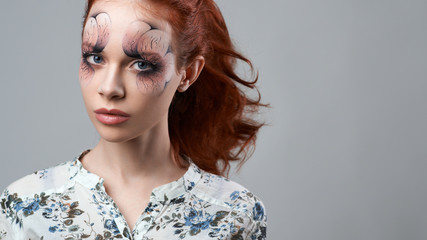 red-haired girl with artistic make-up